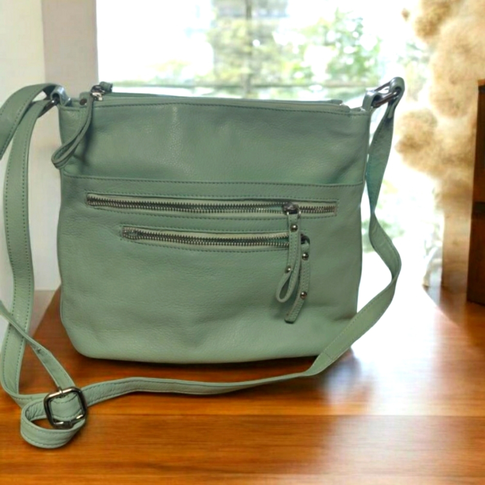 Sleek Mint Green Leather Crossbody Bag with Rounded Edges and Adjustable Strap